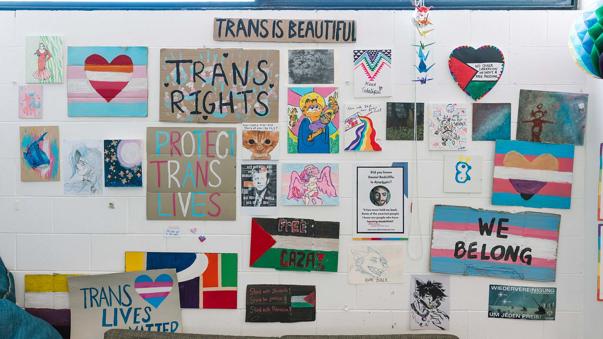 Trans rights posters on the wall in our Queer Space