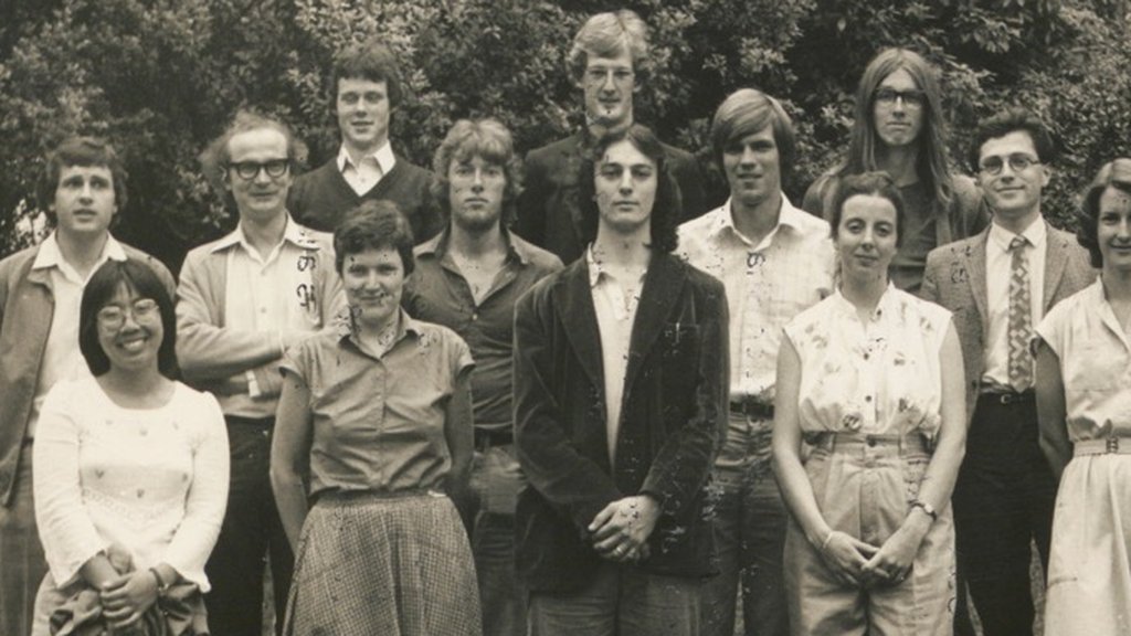 Black-and-white group photo of the 1980 AUSA Executive standing outdoors, including President Kevin Hague and several future Presidents and Life Members
